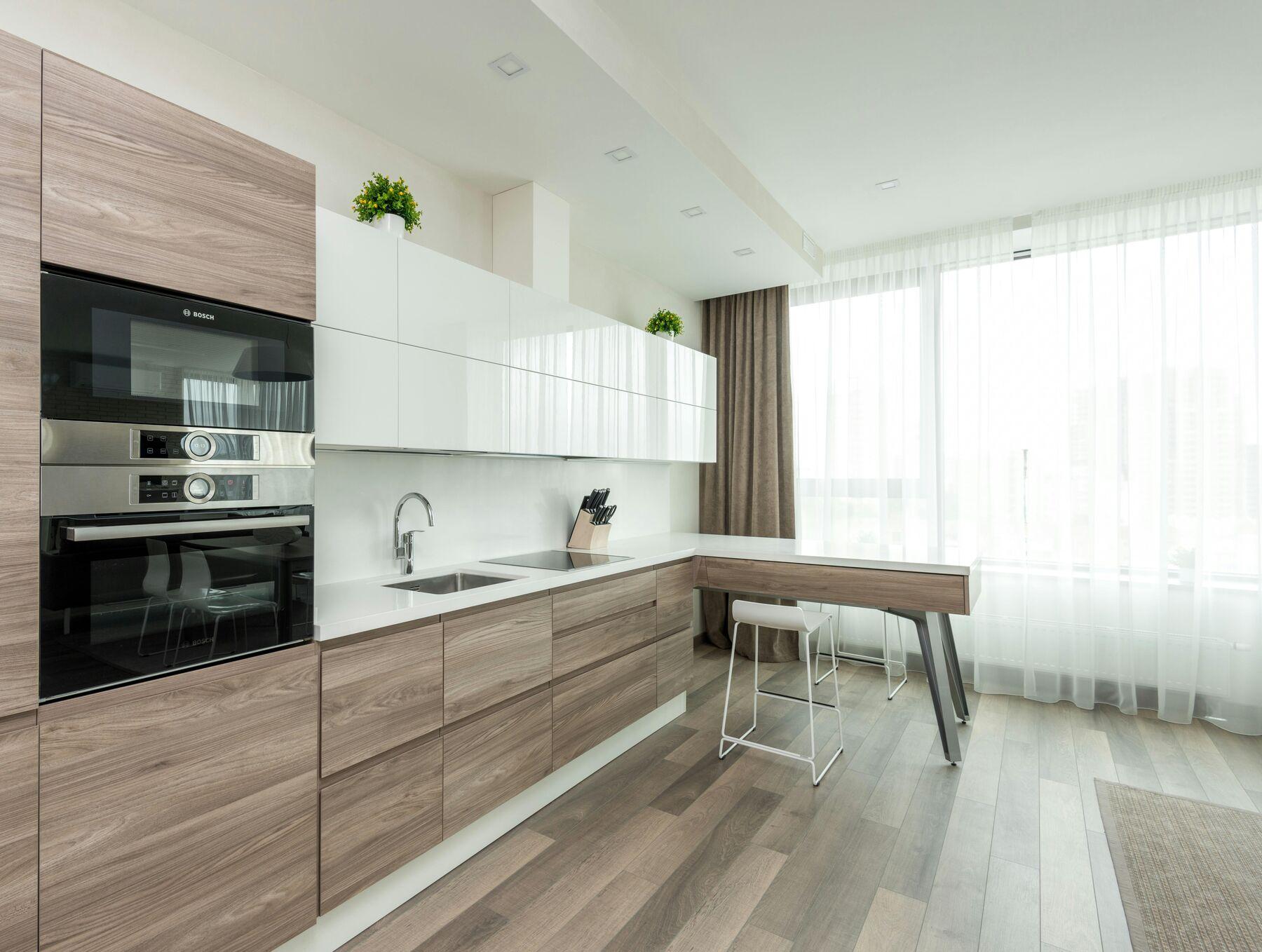 Bright kitchen with floor-to-ceiling white sheer curtains